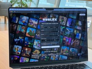 a laptop screen showing the homepage of online game Roblox