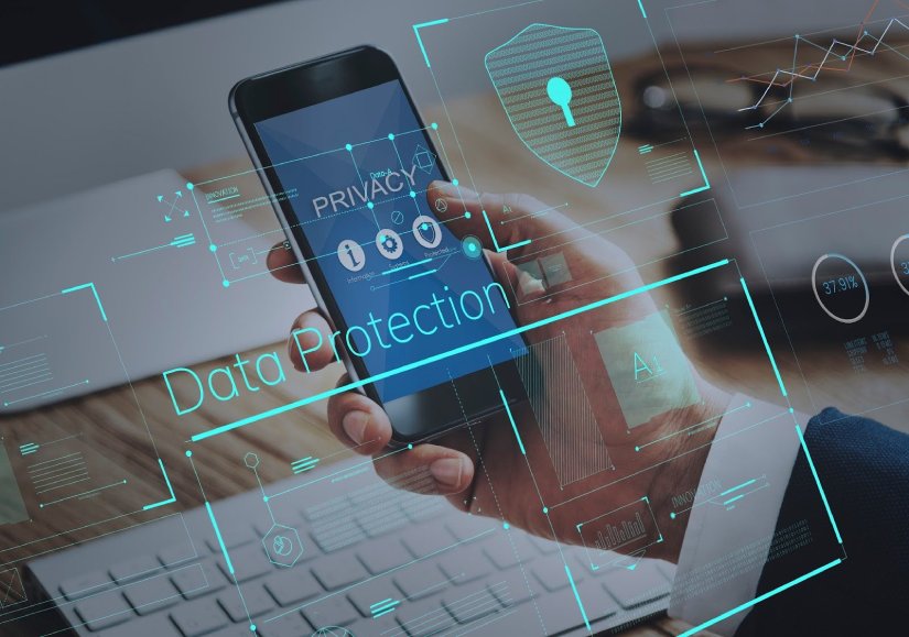 a man holding a phone looking a data protection and privacy settings